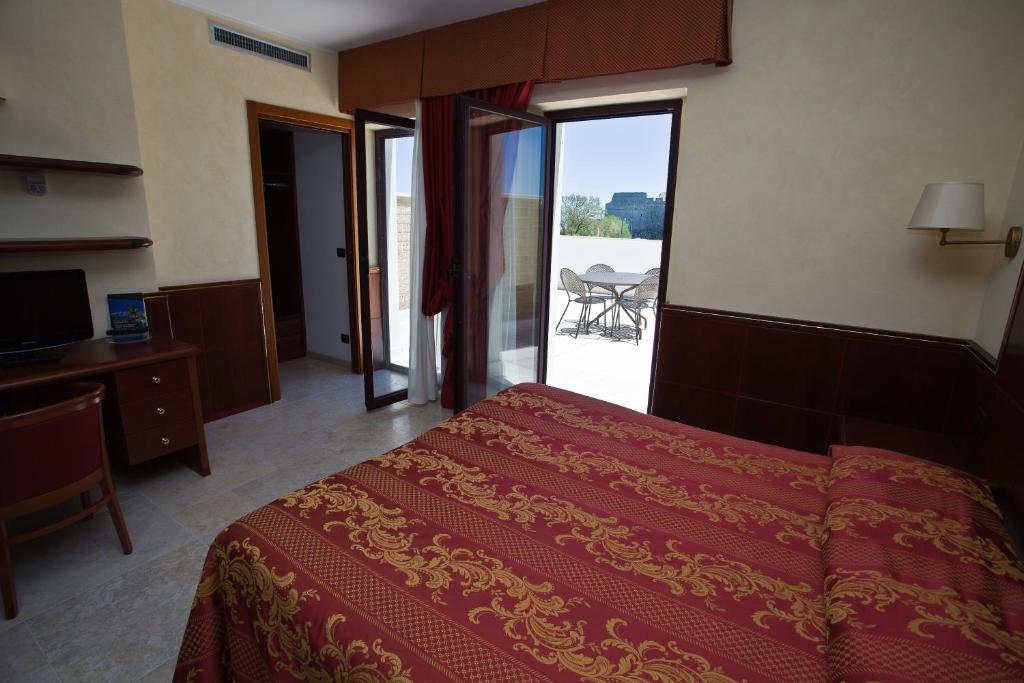 Postel nebo postele na pokoji v ubytování Hotel Relais dei Normanni