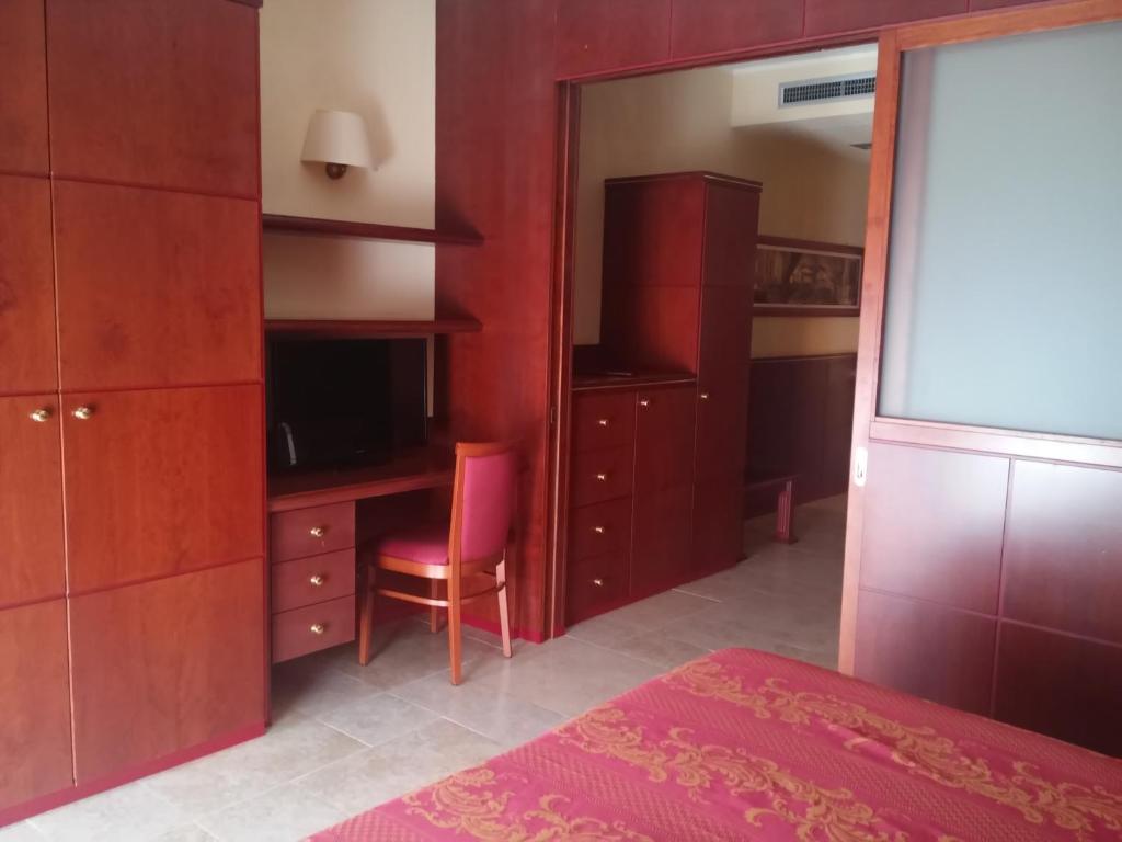 Postel nebo postele na pokoji v ubytování Hotel Relais dei Normanni