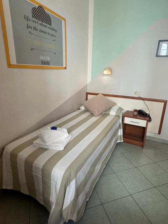 Łóżko lub łóżka w pokoju w obiekcie Hotel Villa Caterina