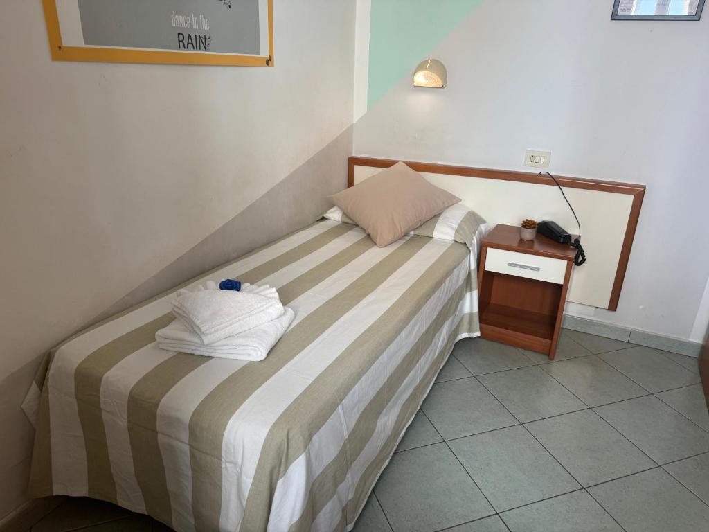 Łóżko lub łóżka w pokoju w obiekcie Hotel Villa Caterina