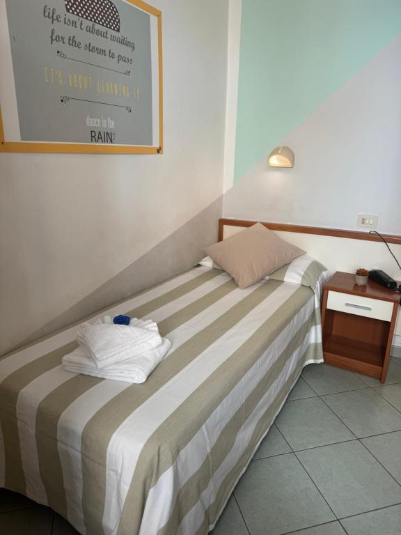 Łóżko lub łóżka w pokoju w obiekcie Hotel Villa Caterina