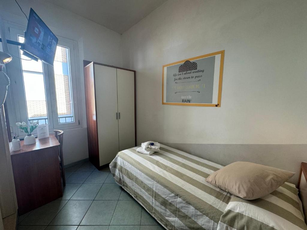 Łóżko lub łóżka w pokoju w obiekcie Hotel Villa Caterina