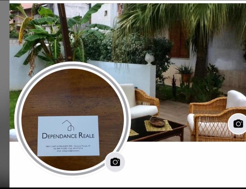 a magnifying glass image of a table with a sign on it at Dependance Reale in Capo dʼOrlando