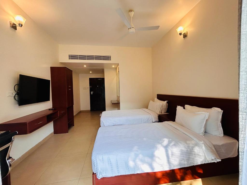 Postel nebo postele na pokoji v ubytování Le MIAMI RESORT