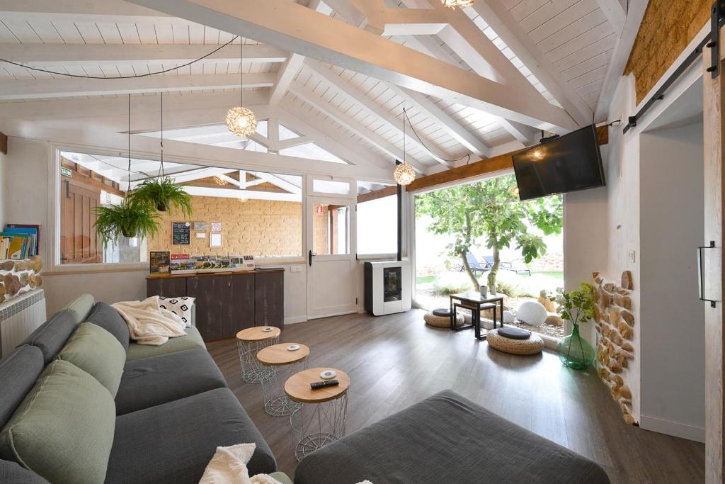 a living room with a couch and a table at El Vallín de Lan in Cerezales del Condado