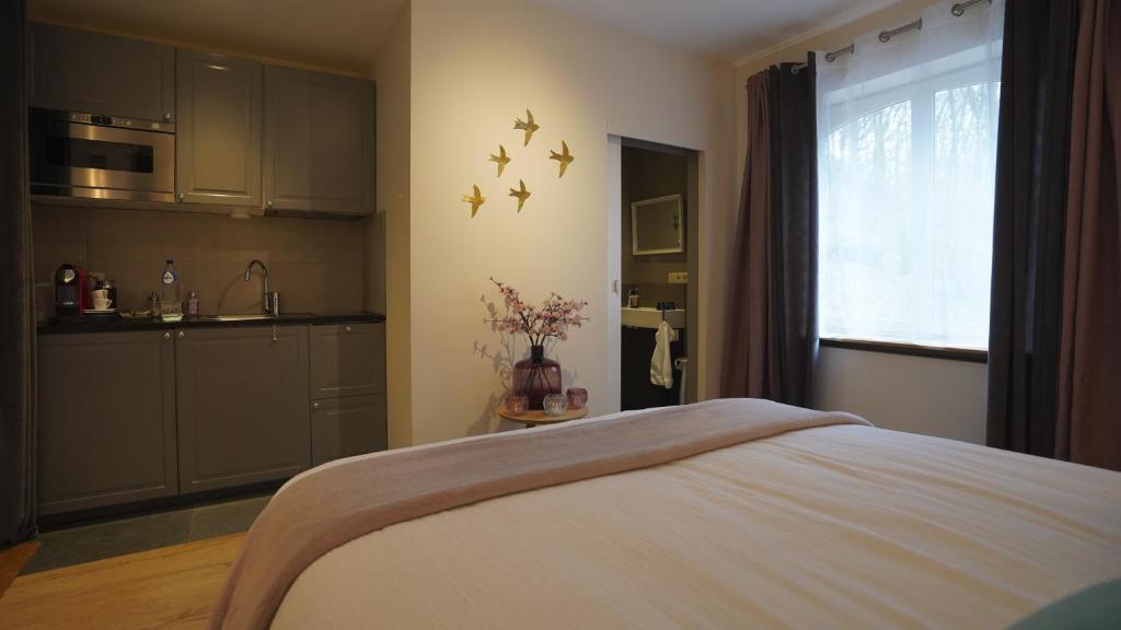 Postel nebo postele na pokoji v ubytování B&B SPA CITADELLE