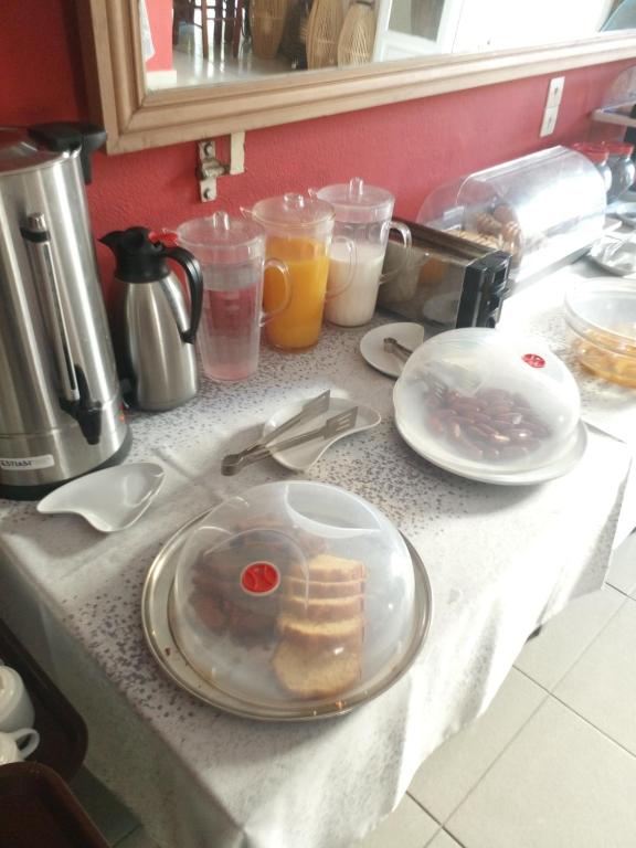 a counter top with a plate of food on it at Frangiscos in Parikia