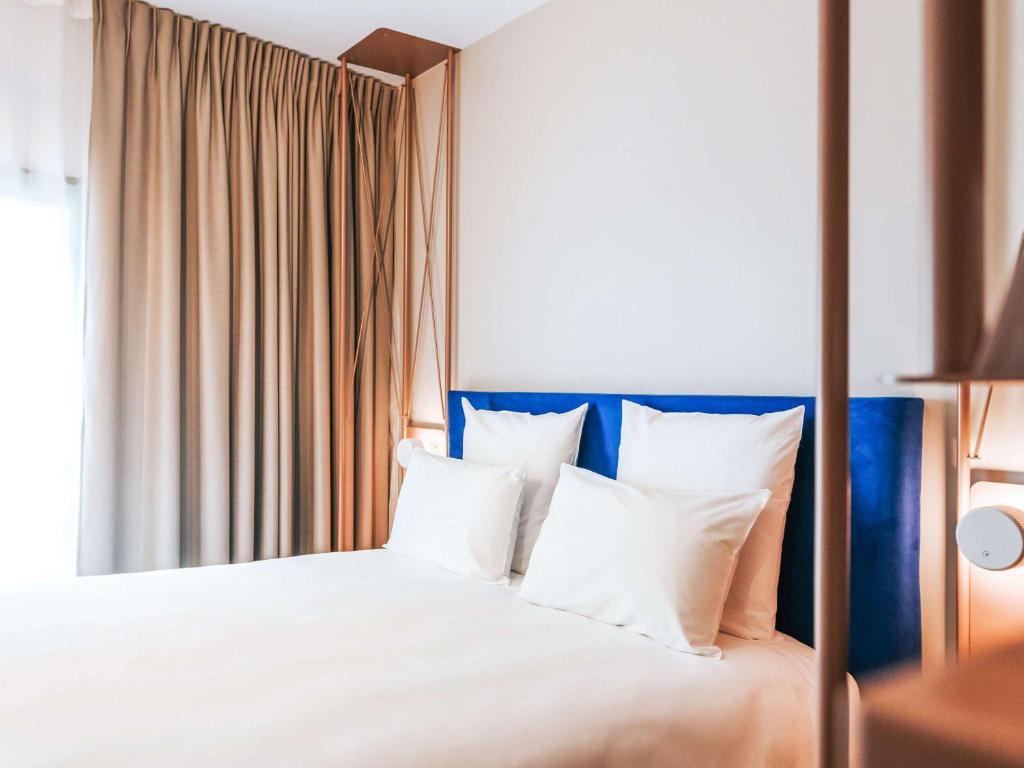 Postel nebo postele na pokoji v ubytování Mercure Brest Centre Port