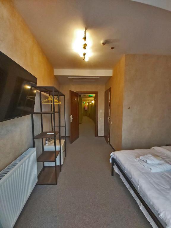 Postel nebo postele na pokoji v ubytování Green Inn Hotel