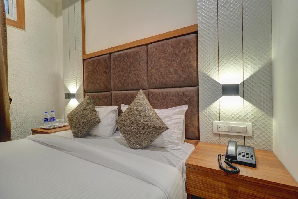 Postel nebo postele na pokoji v ubytování Hotel Sion Fort