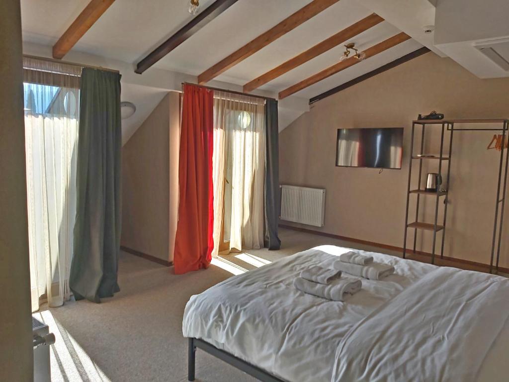 Postel nebo postele na pokoji v ubytování Green Inn Hotel