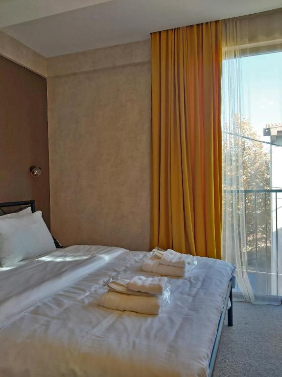 Postel nebo postele na pokoji v ubytování Green Inn Hotel