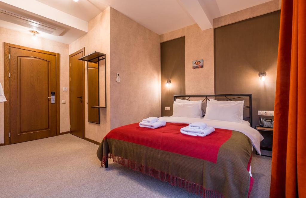 Postel nebo postele na pokoji v ubytování Green Inn Hotel