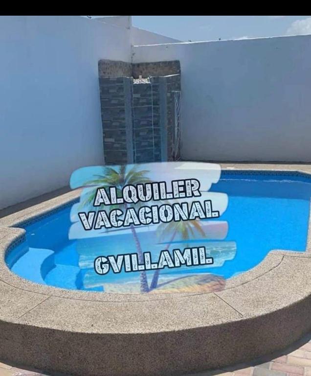 a sign for a swimming pool in a building at CaSa PrivaDa con Piscina in Playas