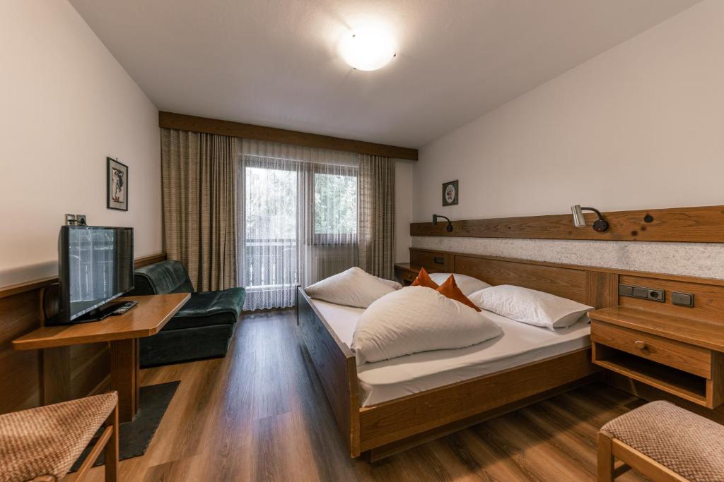 Postel nebo postele na pokoji v ubytování Hotel Fines