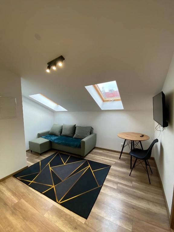 TV a/nebo společenská místnost v ubytování MH Apartments Towarnickiego