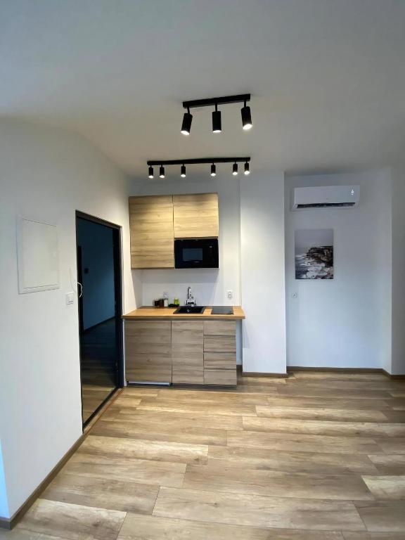 Kuchyň nebo kuchyňský kout v ubytování MH Apartments Towarnickiego