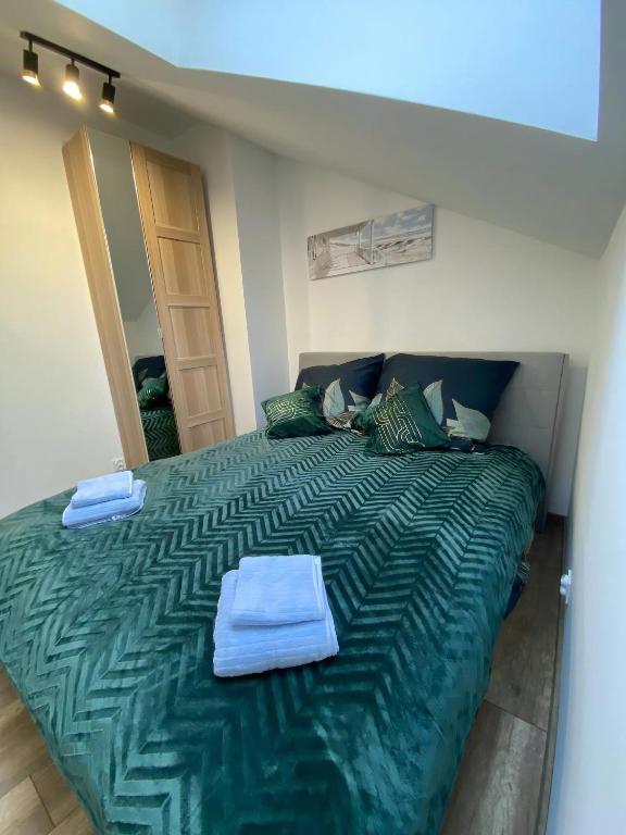 Postel nebo postele na pokoji v ubytování MH Apartments Towarnickiego