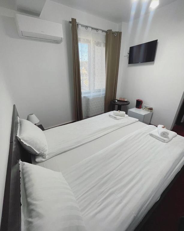Postel nebo postele na pokoji v ubytování Apartamente 9 - Naomi