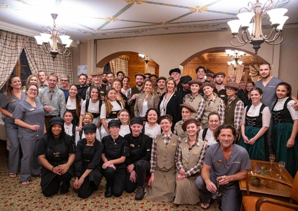a large group of people posing for a picture at Hôtel Alpen Ruitor in Méribel
