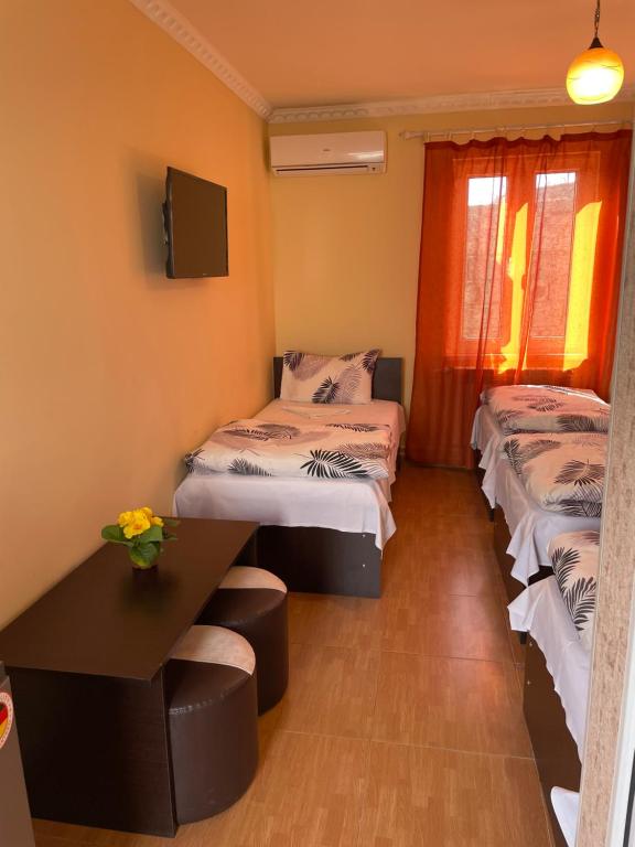 Postel nebo postele na pokoji v ubytování Zangu Hotel