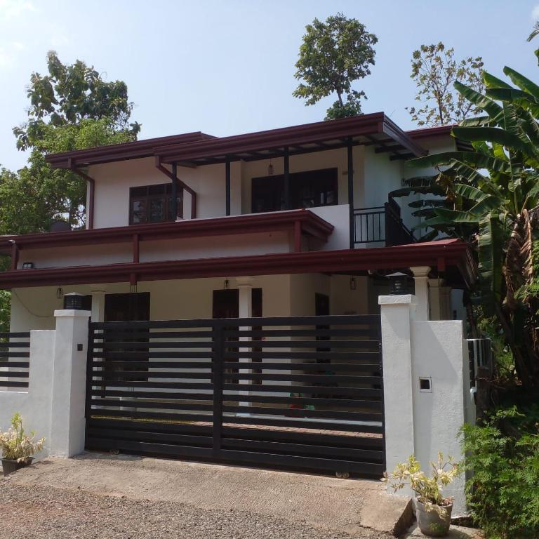 a house with a gate in front of it at Villa in Yakkala, Gampaha 