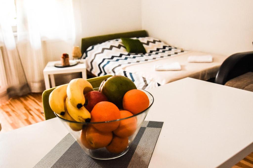 a bowl of fruit on a table in a living room at Svilara in Novi Sad