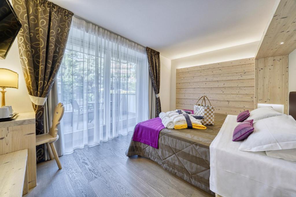 Postel nebo postele na pokoji v ubytování Alpenresort Belvedere