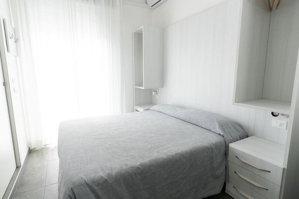 Postel nebo postele na pokoji v ubytování Hotel Eugenio