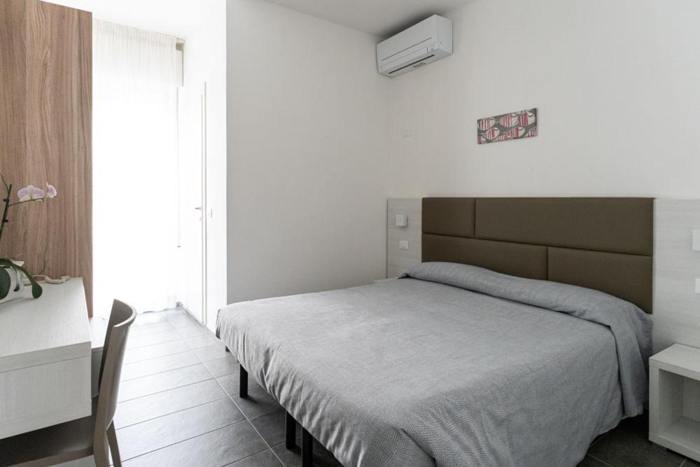 Postel nebo postele na pokoji v ubytování Hotel Eugenio