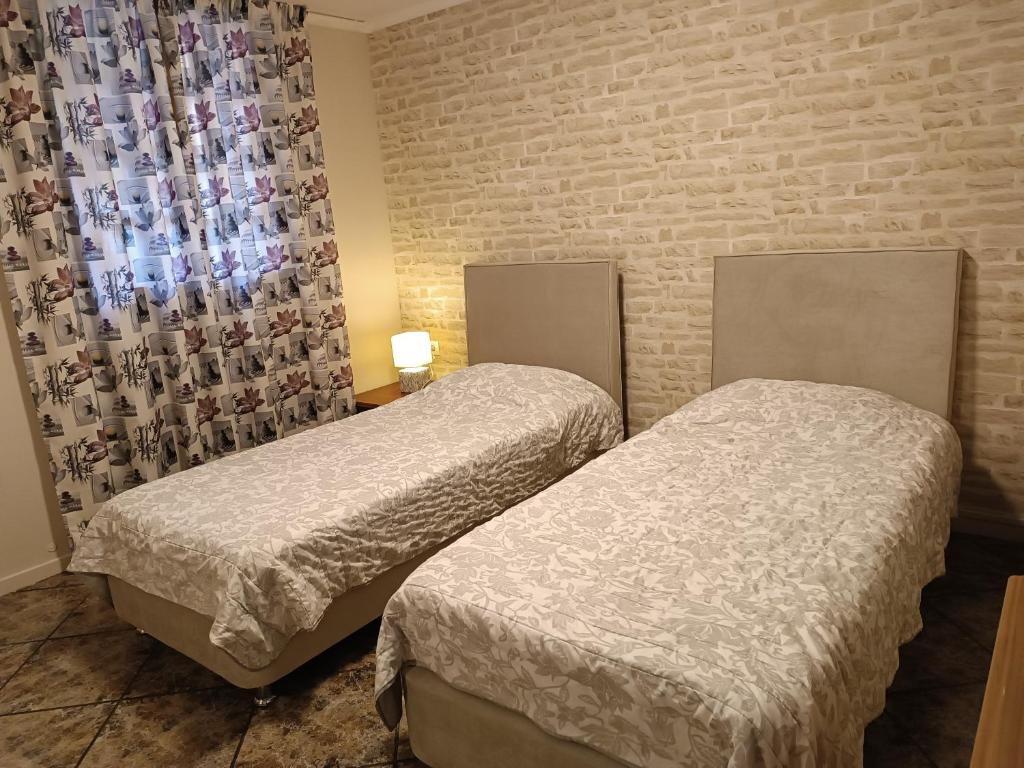 Posteľ alebo postele v izbe v ubytovaní Sunny garden studio