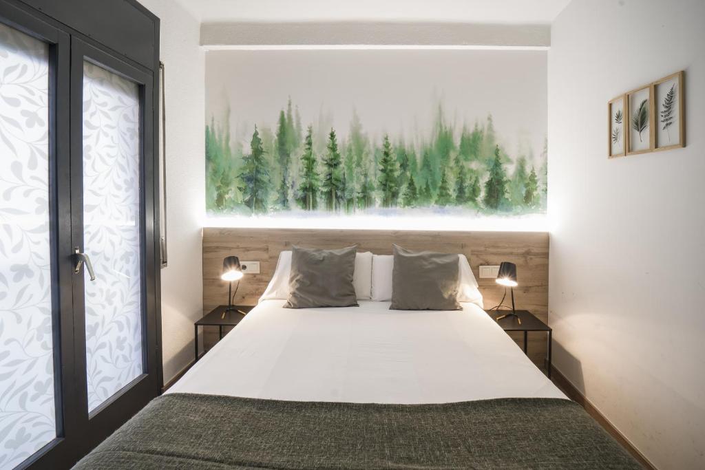 Postel nebo postele na pokoji v ubytování Glaner Hotel Cafe
