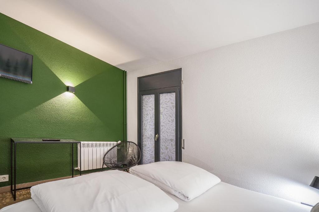 Postel nebo postele na pokoji v ubytování Glaner Hotel Cafe