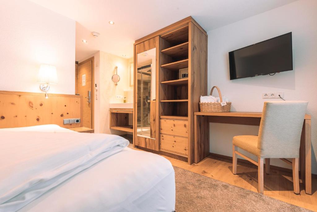 TV a/nebo společenská místnost v ubytování Hotel Olympia