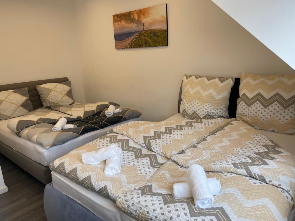 Säng eller sängar i ett rum på Gemütliches Apartment in Geisenheim