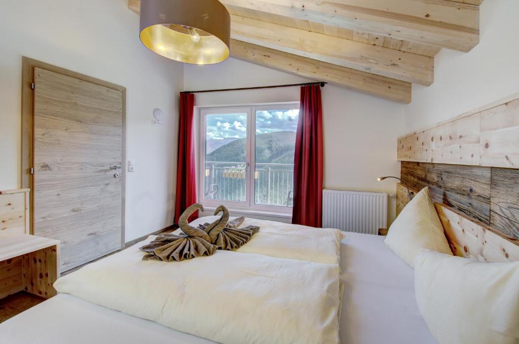 Postel nebo postele na pokoji v ubytování Berghotel Jaga-Alm