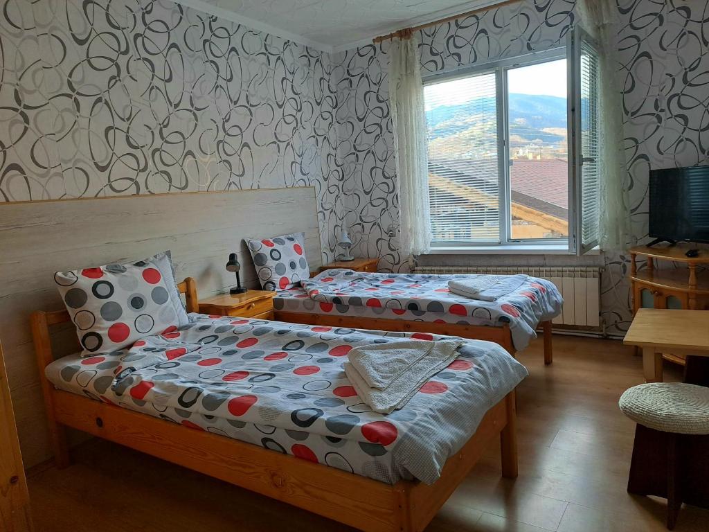 Postel nebo postele na pokoji v ubytování Kovacha Guest House