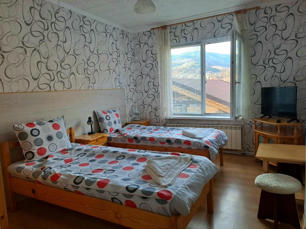 Postel nebo postele na pokoji v ubytování Kovacha Guest House