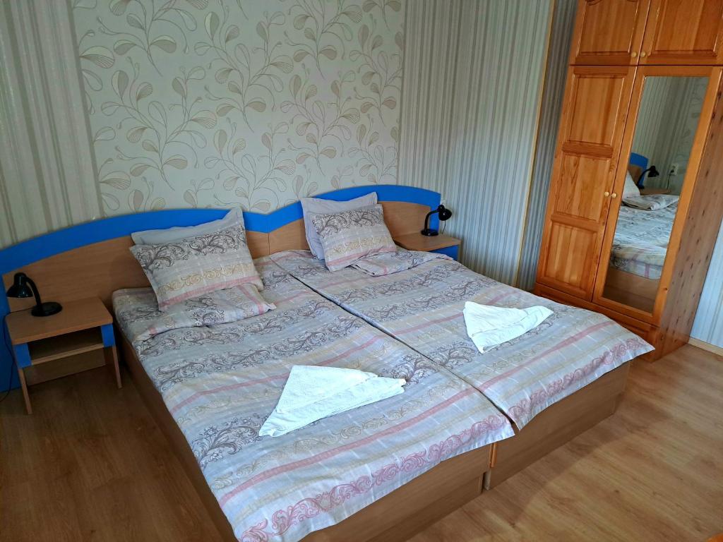 Postel nebo postele na pokoji v ubytování Kovacha Guest House