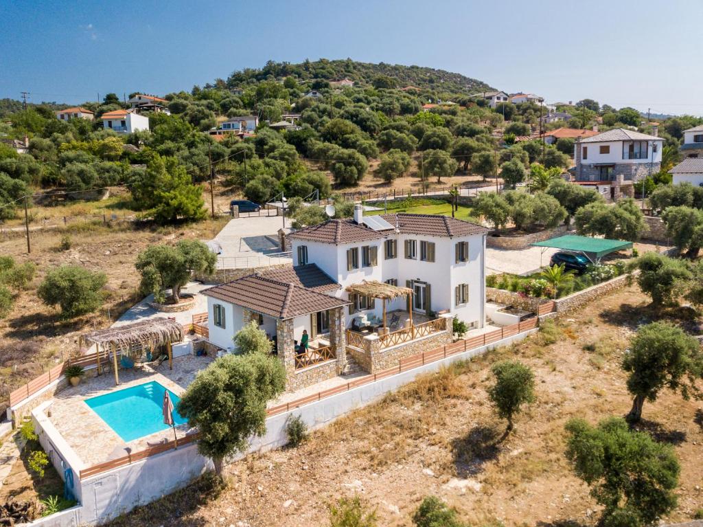 an aerial view of a house with a swimming pool at Villa Luna in Kavála