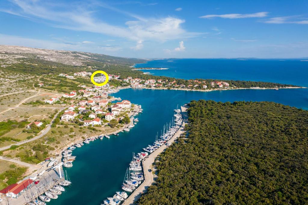an aerial view of a marina with a yellow frisbee at Apartment Mia Šimuni in Šimuni
