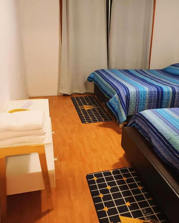 Postel nebo postele na pokoji v ubytování Hostal Al Yaras