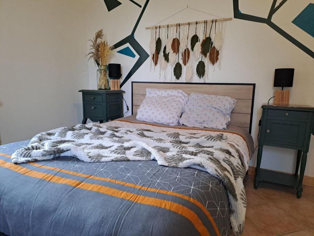 Postel nebo postele na pokoji v ubytování Gîte du Pont de Tancelle