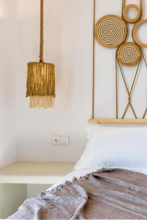 Postel nebo postele na pokoji v ubytování KIANO SUITES