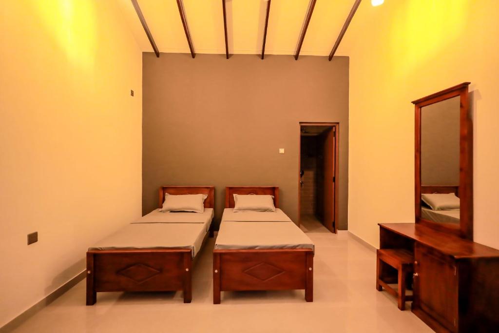 Postel nebo postele na pokoji v ubytování Negombo 146 Homestay