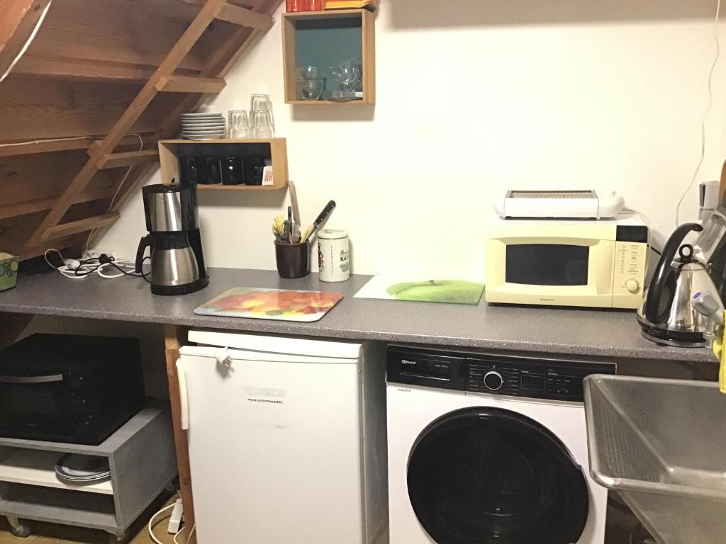 Kuchyň nebo kuchyňský kout v ubytování GETGYR Hostel