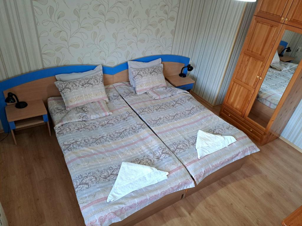 Postel nebo postele na pokoji v ubytování Kovacha Guest House