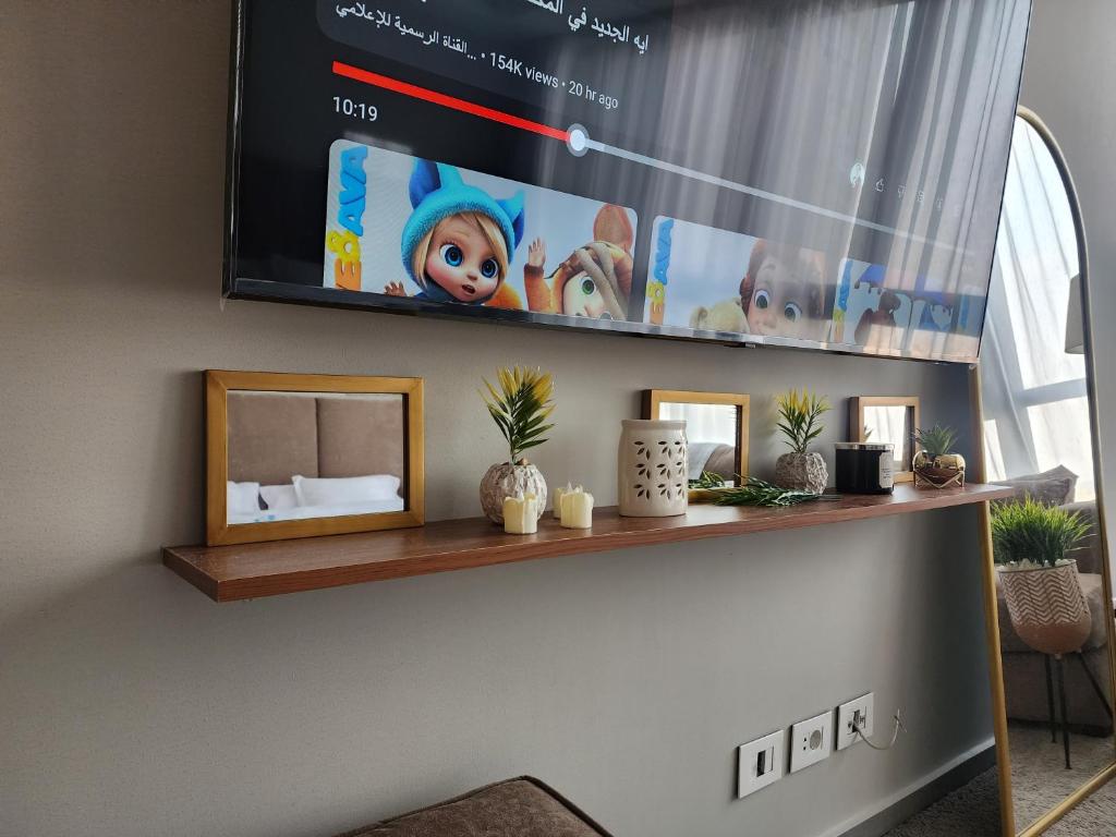 TV a/nebo společenská místnost v ubytování Aeon towers El sheikh zayed