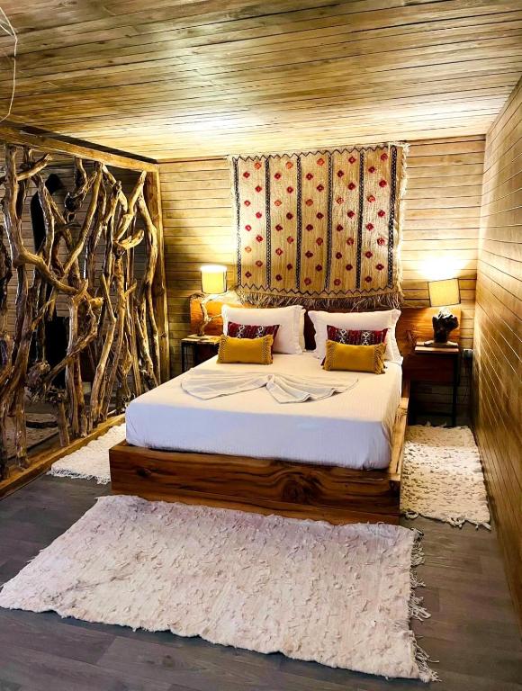 Postel nebo postele na pokoji v ubytování Bio et Bois -Luxury Bio Farm-