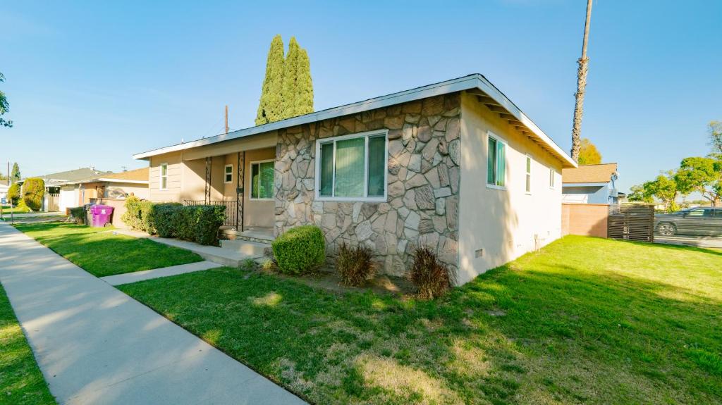 a small house with a stone facade at Long Beach Cozy Remodled Home in Long Beach